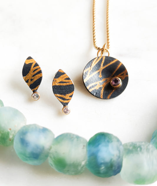 Black and Gold Ribbon Pendant with Montana Sapphire