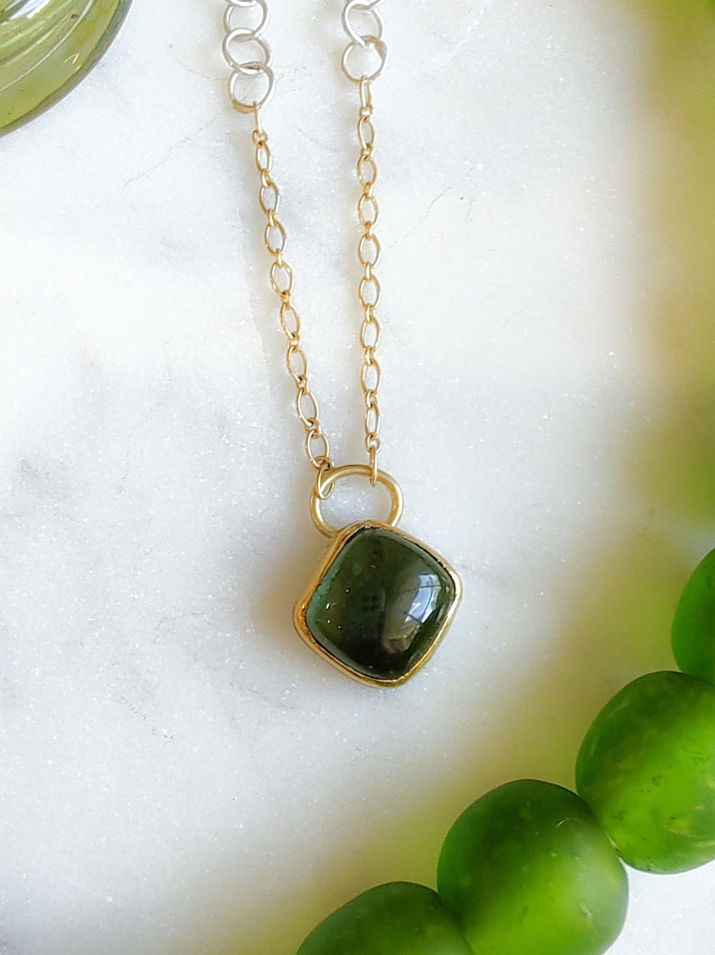 Green tourmaline, gold, and silver necklace