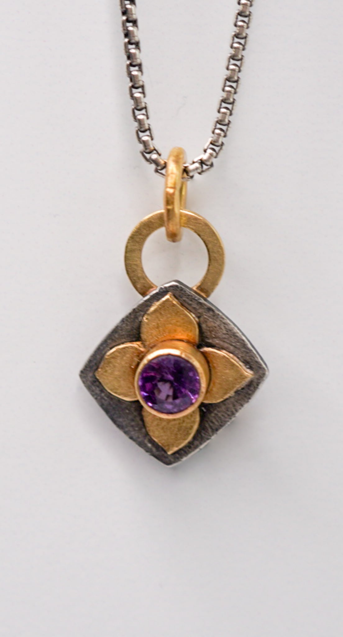 Purple Sapphire and Gold Pendant